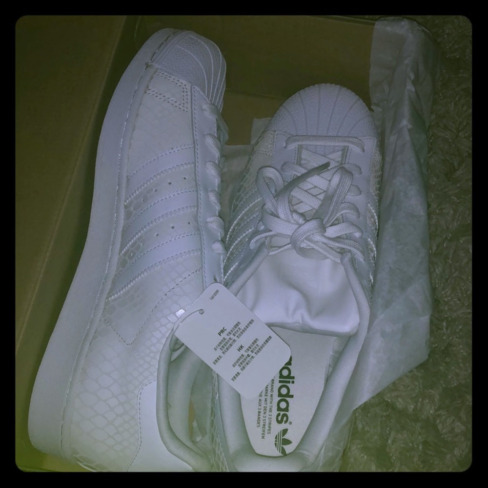Textured white Adidas Shell toe